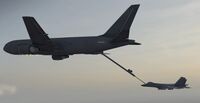 An F/A-26B being refueled by the KC-49.